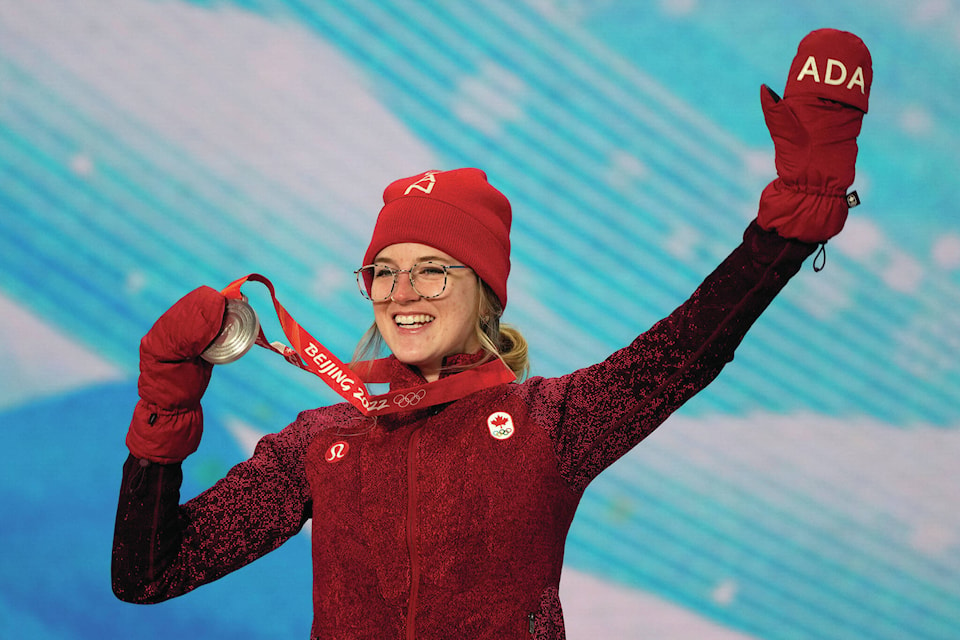 Silver medalist Canada’s Cassie Sharpe celebrates during a medal ceremony for the women’s freestyle skiing halfpipe competition at the 2022 Winter Olympics, Friday, Feb. 18, 2022, in Zhangjiakou, China. (AP Photo/Alessandra Tarantino)