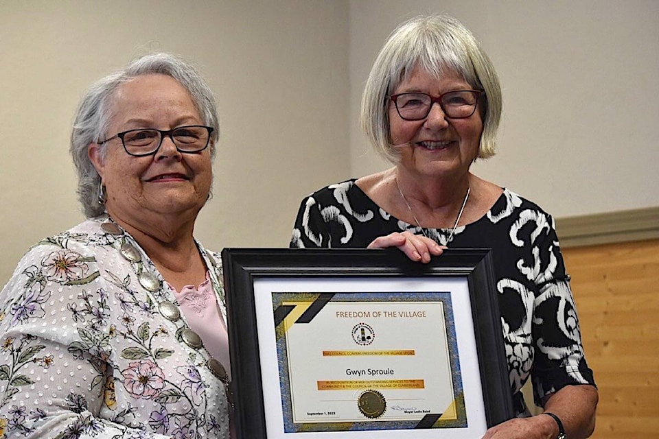 Cumberland Mayor Leslie Baird, left, presented Gwyn Sproule with the Freedom of the Village at a special council meeting.