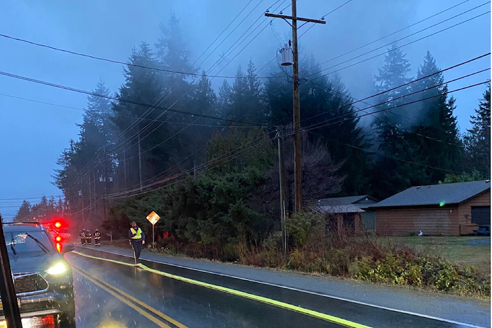 Firefighters roll out hose-line as smoke billows from a residential lot on Ryan Road East Friday, Jan. 6. Photo by Michelle Wells.