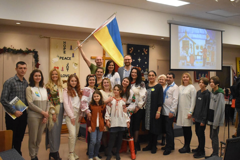 Some of the newcomers to the Comox Valley, from Ukraine - including many of those who performed at the concert - pose for a photo. Photo by Terry Farrell