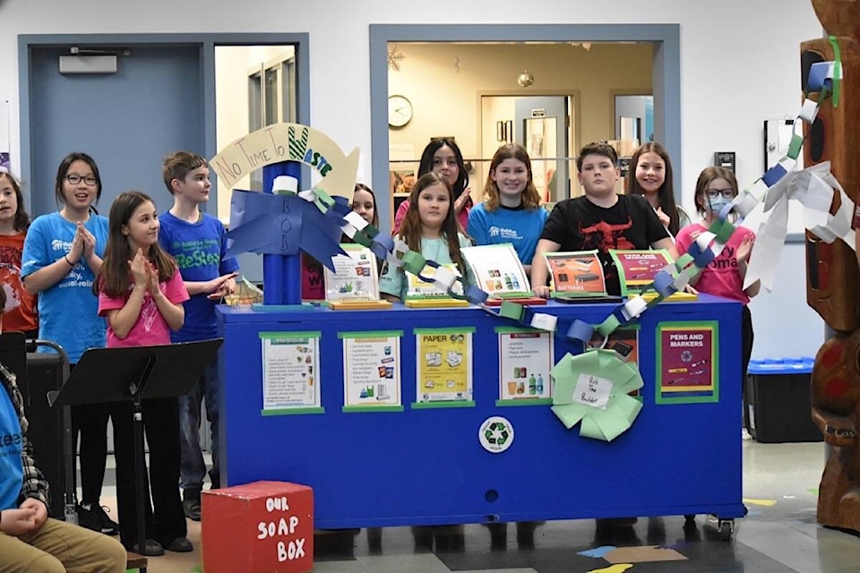 Queneesh Elementary held a grand opening Wednesday of a new student-created recycling depot. Scott Stanfield photo