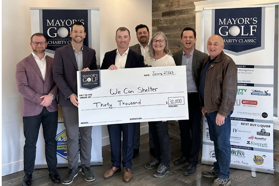 Charlene Davis of the WeCan Shelter Society receives a cheque for $30,000 from the Mayor’s Cup Charity Classic committee. Photo supplied