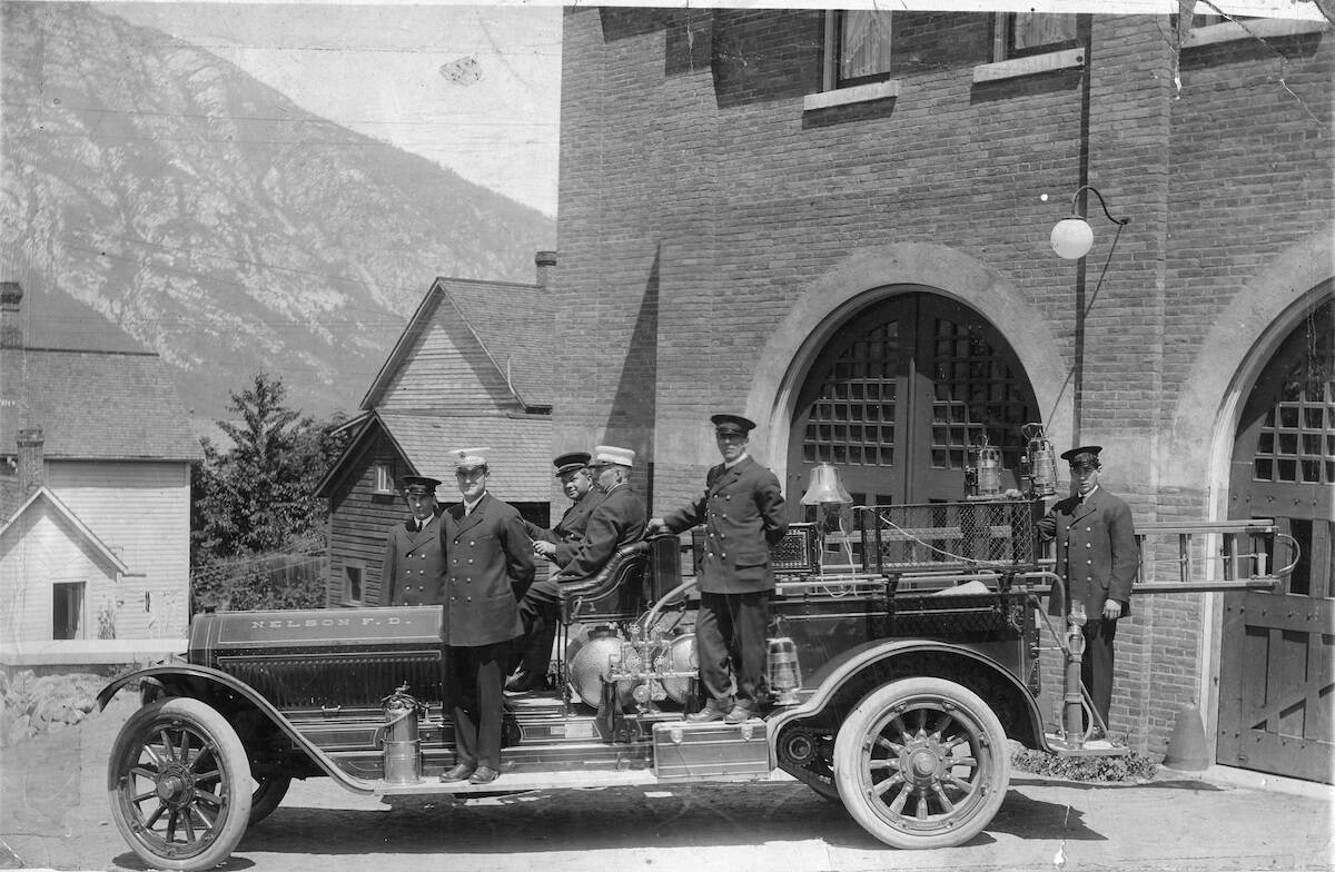 Nelson Fire Department truck and six firemen outside the firehall including fire chief Donald Guthrie, around 1920. Photo: Nelson Museum, Archives and Gallery