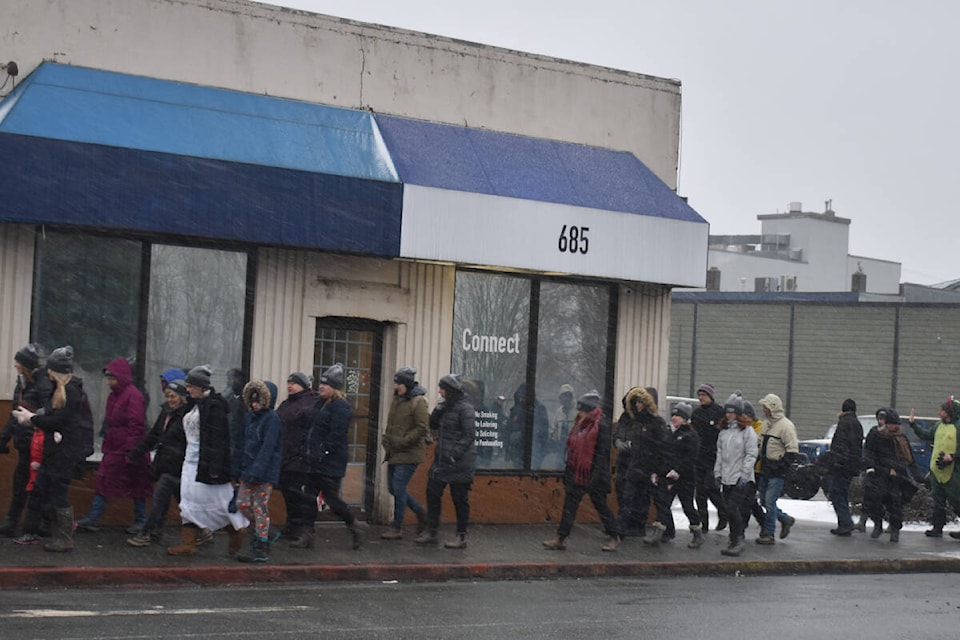 Walkers pass the Connect Centre, one of the shelters in Courtenay, during the 2023 Comox Valley Coldest Night of the Year walk on Saturday, Feb. 25. Photo by Terry Farrell