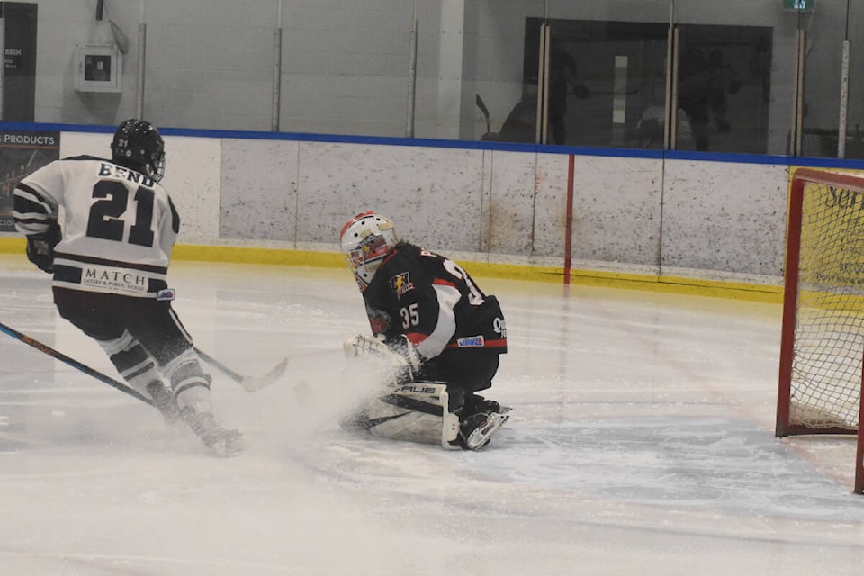 Campbell River Storm goalie Nick Peters stops Comox Valley Glacier King forward Alex Bend in first-period action of the Vancouver Island Junior Hockey League playoff match. The Storm won 5-2 to take a 2-0 lead in the best-of-seven series. Photo by Terry Farrell