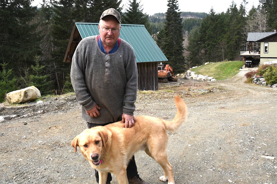 Colin Murray is one of about a dozen homeowners and businesses on Franklin River Road that were cut off from the city’s water supply for more than 24 hours after a logging truck left the road and crashed into a main water supply pipe on that road, Thursday, March 9, 2023. (SUSAN QUINN/ Alberni Valley News)