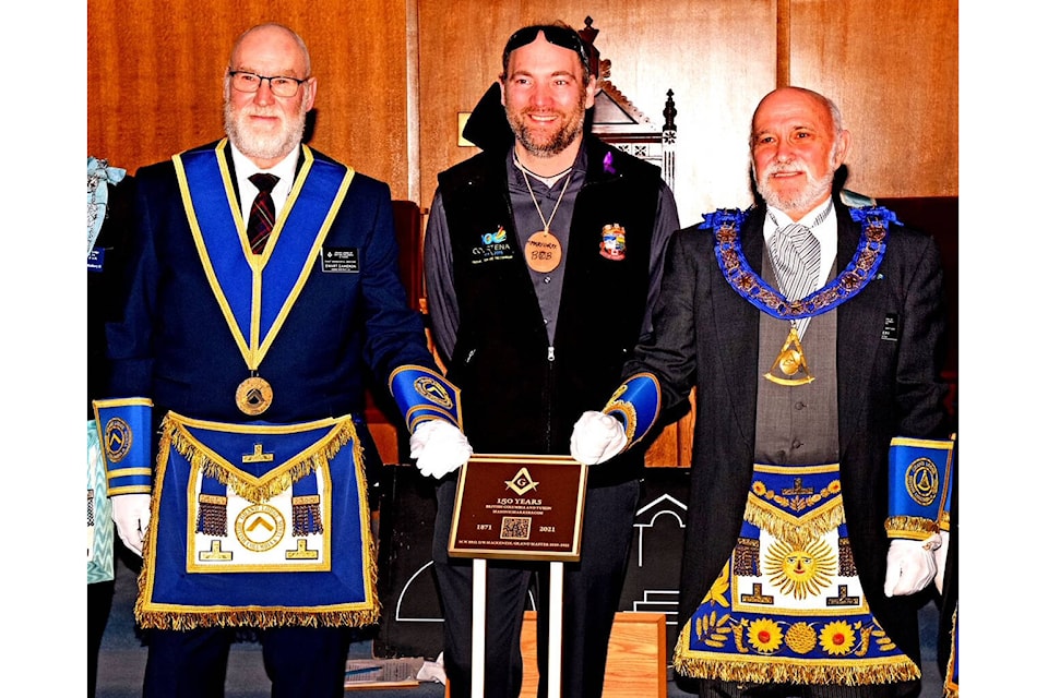 District Deputy Grand Master Ewart Cameron (left) and Grand Master of BC & Yukon, Ken Overy flank Courtenay Mayor Bob Wells at the recent celebration. Photo supplied
