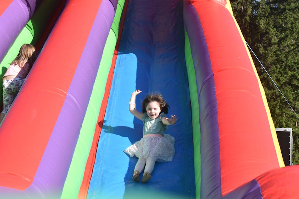 Five-year-old Lokelani Kaiwi had a thrill on the big slide at the Arden Elementary penny carnival. Photo by Terry Farrell/Comox Valley Record
