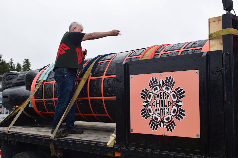 Kwakiutl master carver Stan Hunt blesses the monument during the June 16 ceremony at Carrot Park in Port Hardy. (Tyson Whitney - North Island Gazette)