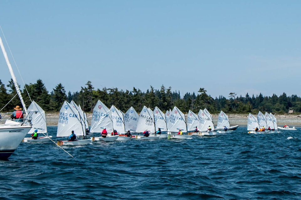 All lined up as the start flag is dropped at the 2023 Optimist Class Provincial Championships on June 24-25, hosted by the Comox Bay Sailing Club. Photo by Fil Bohac