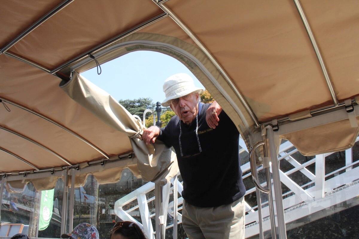 Victoria Harbour Ferry captain Christopher Causton welcomes tourists aboard an electric vessel for a tour of the Victoria Harbour sharing history and knowledge along the way. (Christine van Reeuwyk/News Staff)