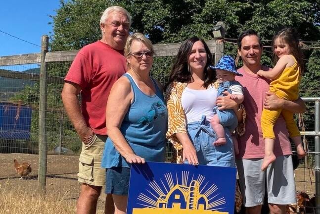 Generations of The Smith family have been farming in the Cowichan Valley since 1897. They were recently recognized with the Century Farm award celebrating 100 years of farming. Posing in front of their chicken pen with this incredible achievement is Michael K. (left) and wife Sheila, Michael D.’s wife Courtney holding their son Michael J., and Michael D. holding their daughter Charlotte. (Chadd Cawson/Citizen)