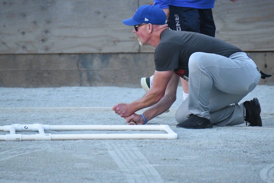 Members of the Port Cubs are busy on Wednesday, July 19, 2023 getting the right field foul line lined up with home plate at Rec Park in preparation for a senior men’s baseball game. Baseball hasn’t been played at Rec Park since 1960. (SUSIE QUINN/ Alberni Valley News)