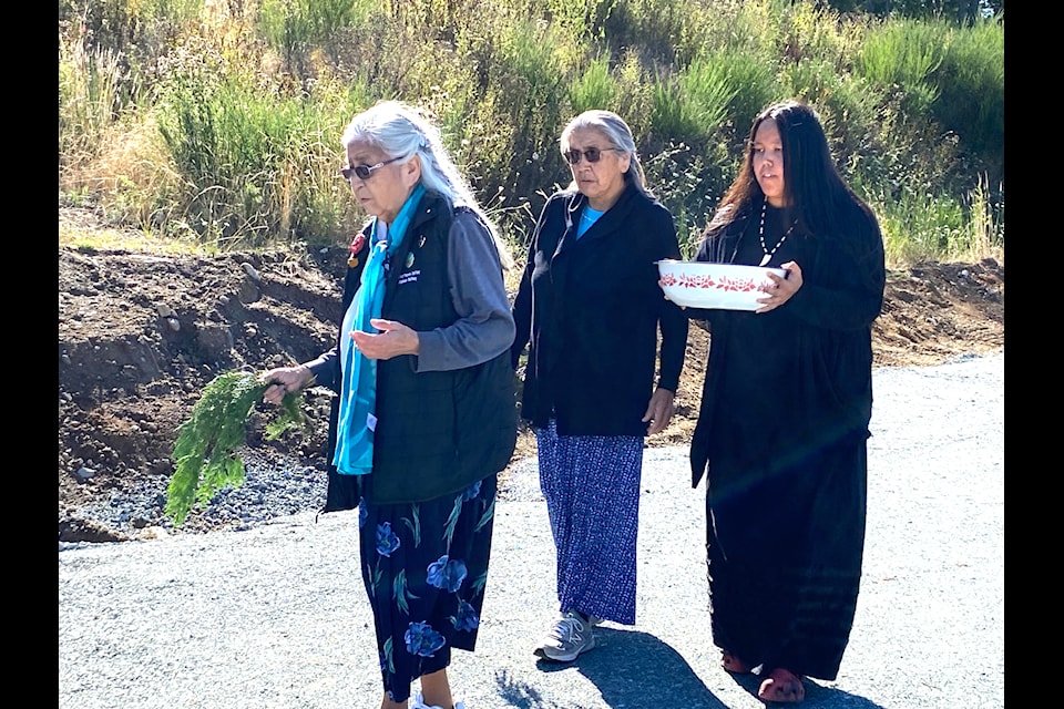 Guests were invited to a special ceremony on Malahat First Nation territory where a new and battery factory will be built in partnership with Energy Plug. A sacred ground blessing was led by Malahat First Nation elder May Sam who was joined by her daughter Josie May and her great granddaughter Evelyn Underwood. Her son Rob Sam, prepared the traditional medicine and provided drum and song for the ceremony.