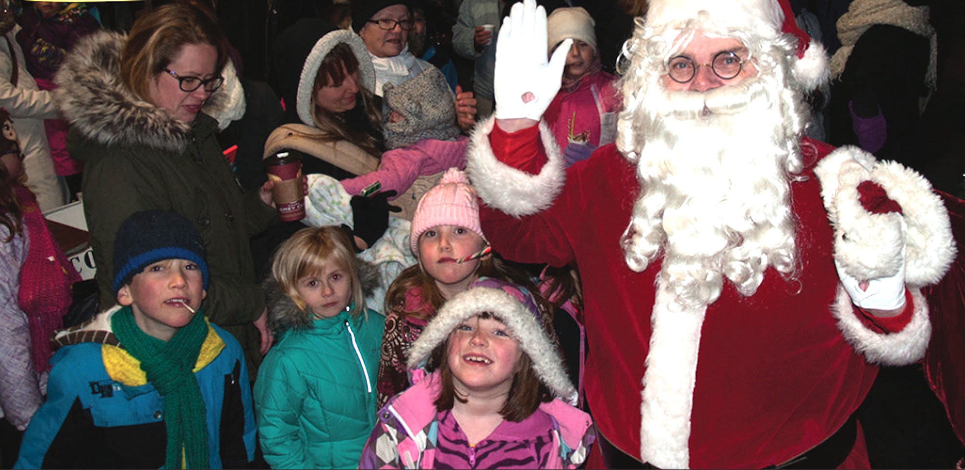"Santa Claus rode in with the rest of the parade last Saturday (Nov. 29), carrying a sack of goodies for the kids."