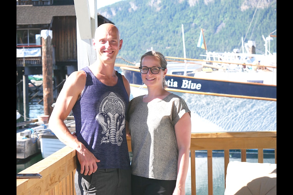 Brandon Kirk of Lake Cowichan and his partner Julia Balabanowics are working on their new podcast 'Beyond Your Wildest Imagination' that will not only focus on those sharing their own personal stories around addiction but how beautiful life can be after it. The couple stands outside the floating office space in Cowichan Bay where they will be recording their podcast, and where Kirk practices Integrative Somatic Therapy to help people work through stored trauma, which often goes hand-in-hand with addiction.