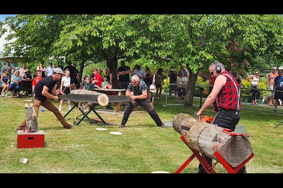 Loggers demonstrated logging skills in competitions against each other, such as one man using a chainsaw against two men using an old fashioned tree saw.