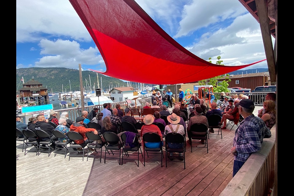 Special guests, community members, and members of Cowichan Tribes and the Cowichan Wooden Boat Society packed the patio porthole located behind the Cowichan Bay Maritime Centre for the long awaited unveiling of the 99-year-old heritage pier on May 16