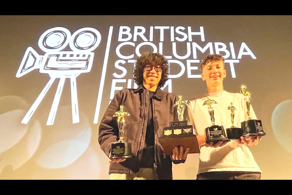 Jason Cheng (left) won several awards at the BC Student Film Festival last month including 'Best Documentary'  and Best Overall Film (Senior). He poses with his friend and fellow QMS student Tate Marston, son of John who was the subject for Cheng's film. Tate, who is also a part of the QMS Film Arts  Program, and was in attendance as a peer supporter, and a representative of the Marston family. (Submitted)