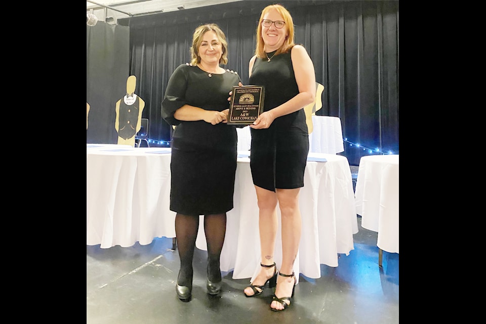 Amber Batty accepts the award for A&W Lake Cowichan. 