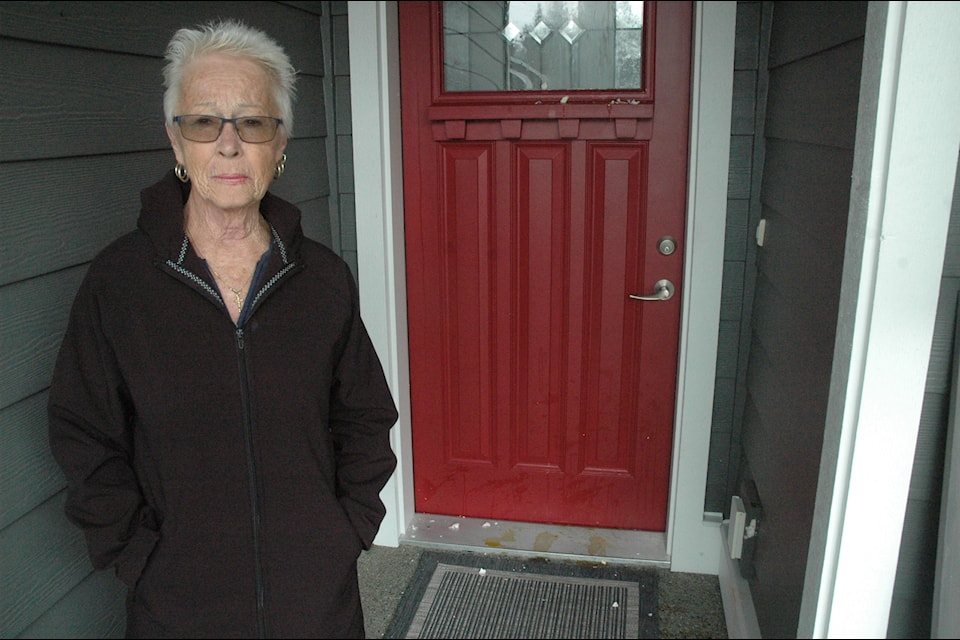 The home of Beverly Stone was egged on Halloween  night, leaving her with a big cleaning bill. Pictured is Stone next to eggs and shells all over her front door and the rest of her home.