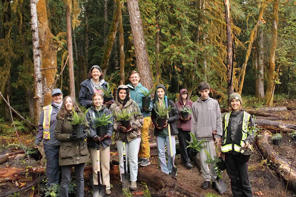 Grade 11 students from Lake Cowichan Secondary get the opportunity to get  their hands dirty at Meade Creek planting Streamside Native plants.