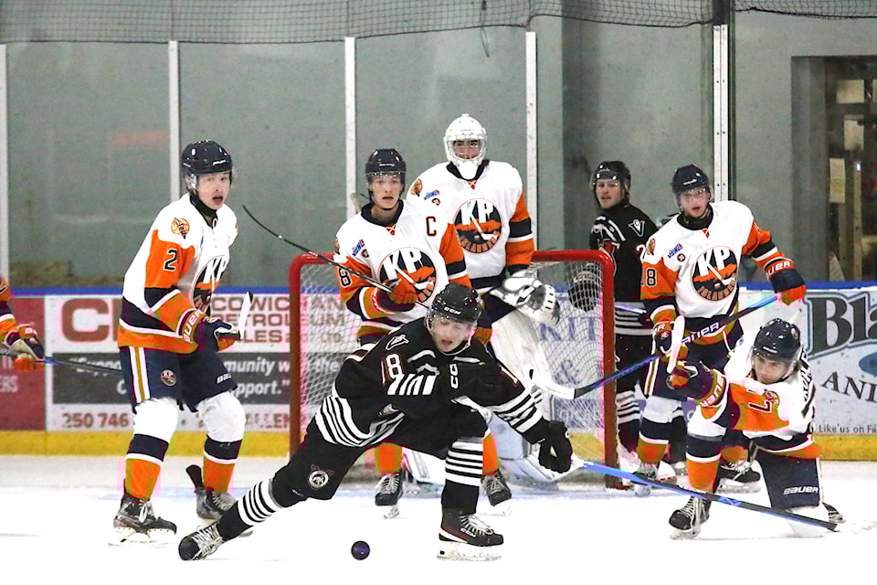 His teammates look on while Bryce Kohler clears the puck out of their defensive zone during the Islanders 5-1 home loss to the Victoria Cougars on Saturday, Sept. 14. The Lake Cowichan Kraken play host to the Cougars on Sept. 27 at the Cowichan Lake Sports Arena. 