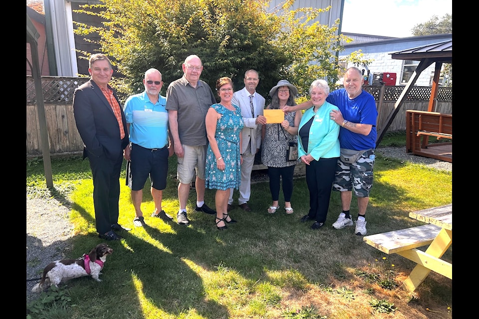 The  Clements Centre for Families board of directors received a $5,000 cheque from Gord Closson (far right) and Kathy DiLalla (third from right) following the 2024 Closson Fall Classic ball tournament. Over the past five years the event's organizers have donated $18,000 to the centre.