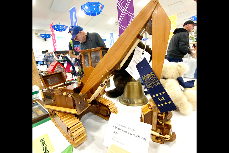 Look at the detail on this originally hand built wooden tractor. No surprise it takes home a first place ribbon in its category.