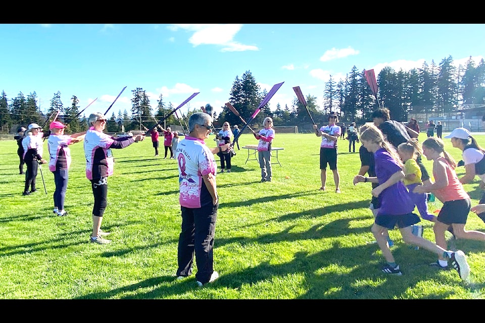 The Cowichan Dragon Divas gave a unique start to the annual Terry Fox Run as they arched their paddles for participants to pass though at the event at Evan's Park.