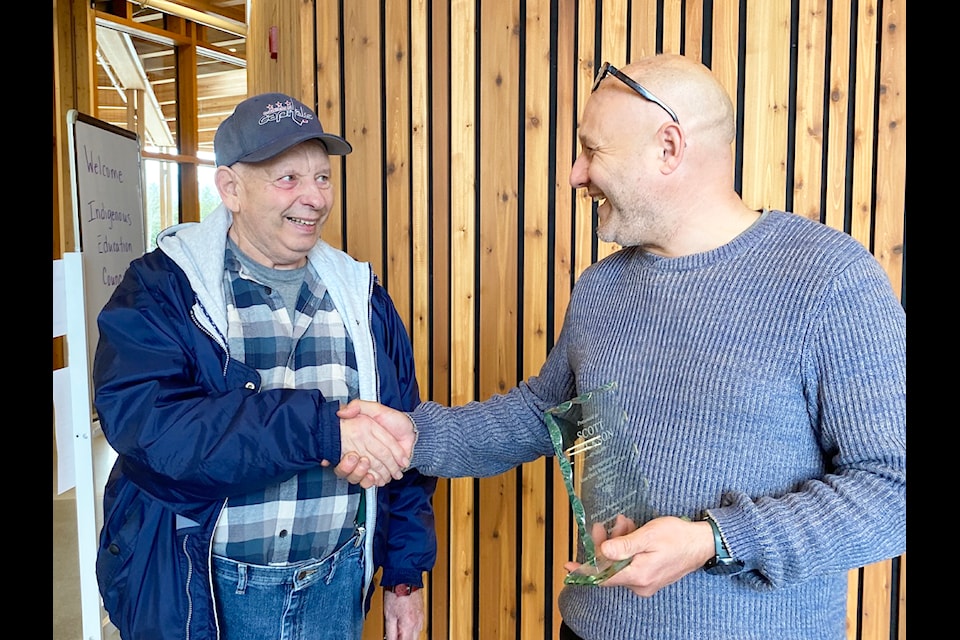 Community member Gene Genereux surprised Quw'utsun School co-principal Scott Jackson with an award to show his gratitude after Jackson came to his aid on Feb. 3. (Chadd Cawson/Citizen)