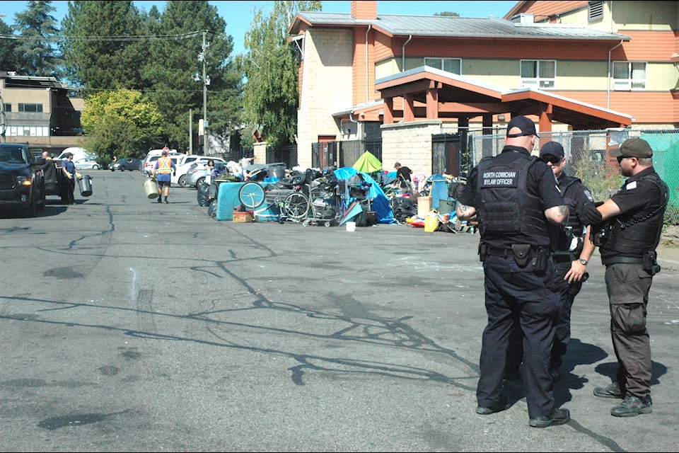 Tents and possessions of the unhoused population on Lewis Street had to be moved on July 31 as officials carried out a clean-up day. (Robert Barron/Citizen) 