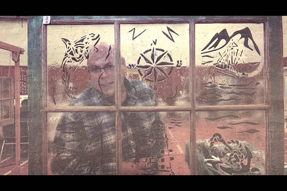 "It's Bob Gordanier's first time inside the hall at the Cabin Fever in Honeymoon Bay, where he was selling his decorative windows and tiles. Gordanier uses a glass fusing process to add colour and shapes."