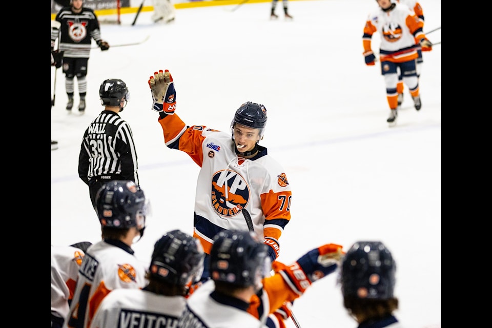 Rylan Davis celebrates a Kerry Park Islanders goal with the bench. 