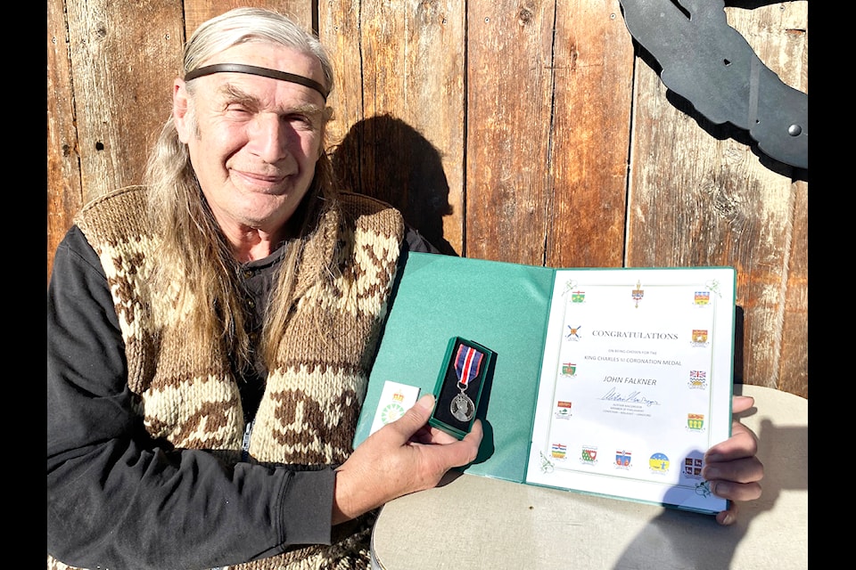 Longevity or Lord-gevity John Falkner received the King Charles III Coronation Medal on Jan. 18 for his dedication and promotion of the arts in the community. Longevity John sits outside the Duncan Showroom as he shows off this prestigious honour. (Chadd Cawson/Citizen)