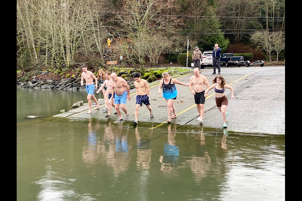 Community members bear cooler temperatures on New Year's Day in Cowichan Bay. While there has not been an official town event since before COVID residents still plunge into 2025 with this yearly tradition.