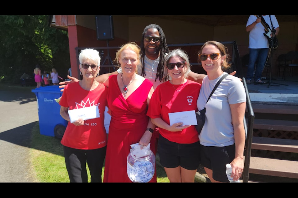 The 50/50 pot was shared between winner, Eva Fearon, of Youbou, and the Ohtaki Society, represented by Jolene Prak and Dana Neuffer, whose children will be visiting sister city, Ohtaki, Japan, this summer. (Kathryn Swan photo)