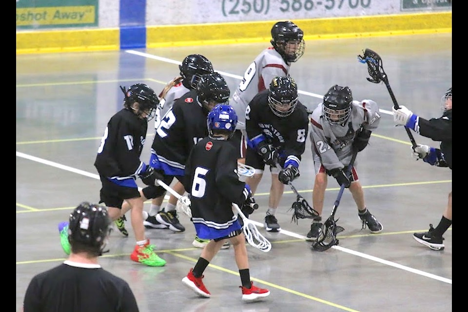 Led by Shae McNeil (centre) The Cowichan Thunder U11 defence converges on a Peninsula Warriors player during a game at the Oceanside Shark Bite tournament this past Saturday.