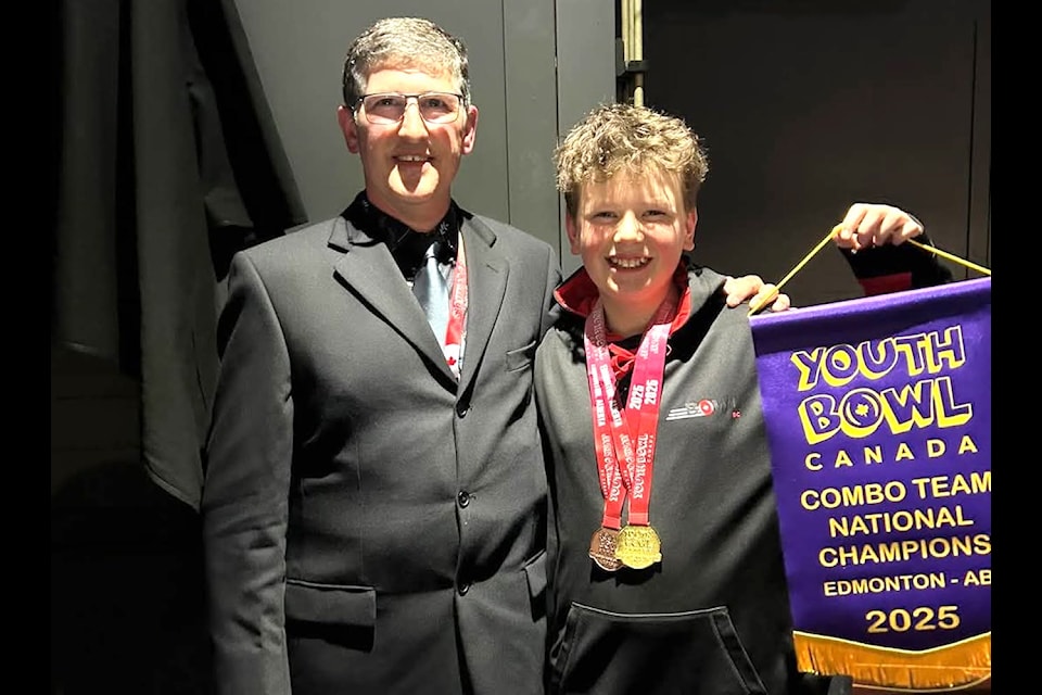 Logan Milne with Mike Frehlick, owner of Duncan Lanes.