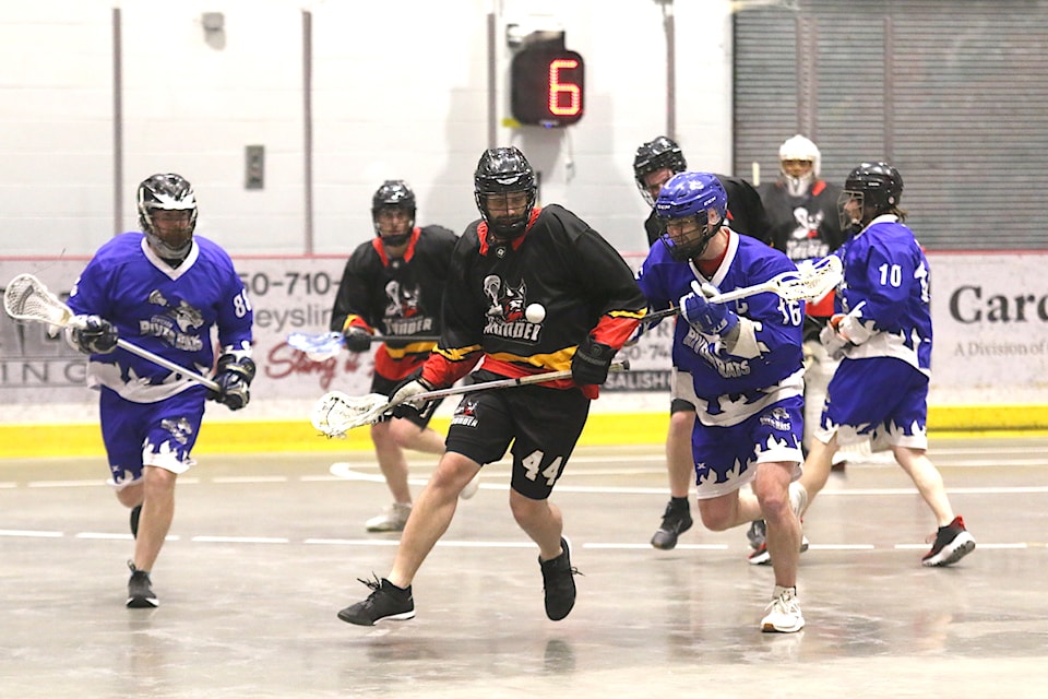 The Thunder's Sean O'Neill and The Rats' Dylan Dewarle position for possession during a 13-3 Thunder victory on May 12 at the Cowichan Arena. 