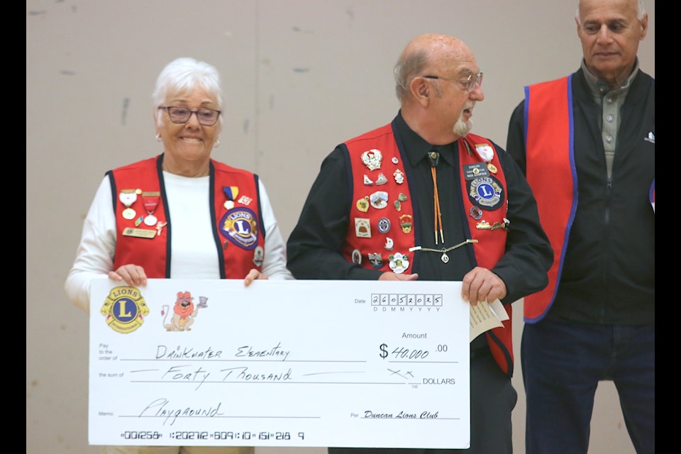 Margaret Wall and Rick Manifold hold a cheque for $40,000 that the Duncan Lions Club have donated to the Drinkwater Elementary School playground fundraising project.