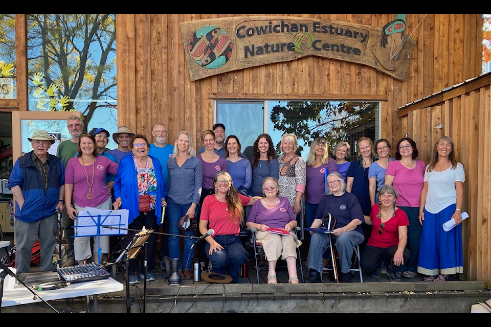 The members of Lila Community Choir pose in front of the Cowichan Estuary Nature Centre. They present 'Sing For Nature' fundraising concert on May 29. (Submitted)
