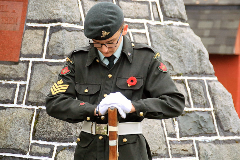 Isaac Affleck of the Khowutzun 2924 army cadets holds vigil at the Lake Cowichan cenotaph. (Lexi Bainas/Citizen)