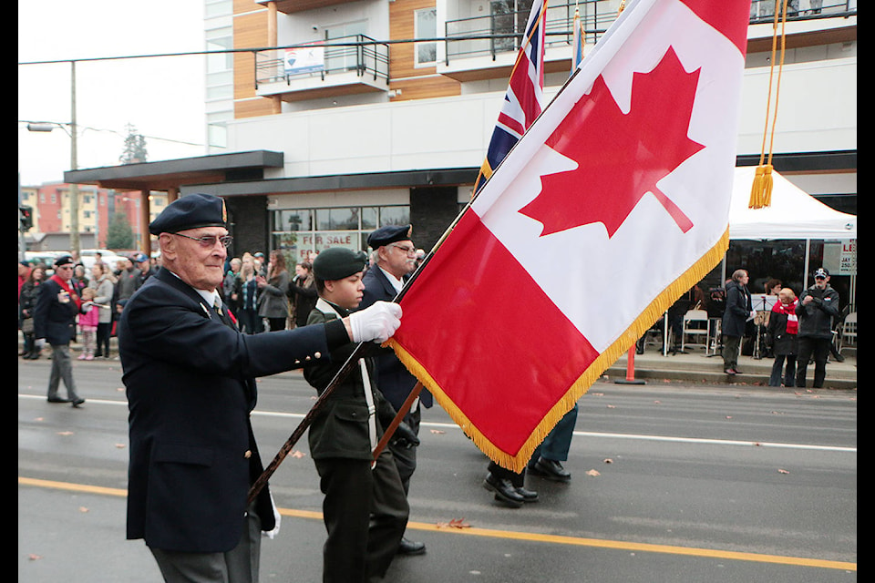 The colour guard marches to the cenotaph in Duncan’s Charles Hoey Park to begin Remembrance Day ceremonies on Nov. 11. (Kevin Rothbauer/Citizen)