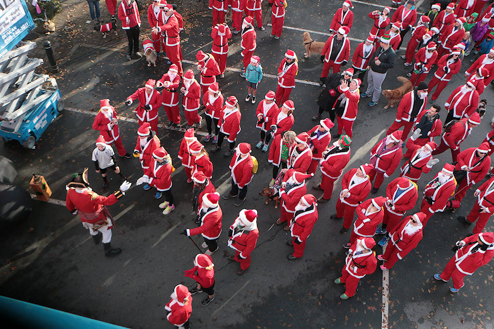Dozens of Santas prepare to make their way out of Duncan’s City Square at the beginning of the Run for the Claus benefit for the Clements Centre on Sunday, Dec. 3. (Kevin Rothbauer/Citizen)