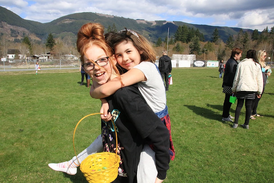 Cherish and Bella enjoy being together out in the sun hunting for Easter eggs at Lake Cowichan’s Little League Park. (Lexi Bainas/Gazette)