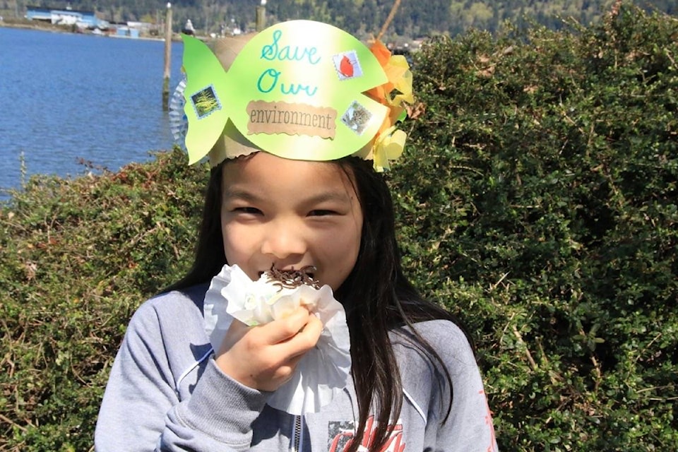Wearing a crown she made, Sophie Patterson then enjoys some B’Earth’Day cake at Cowichan Bay’s Estuary Nature Centre during Earth Day celebrations April 22. For more from the event see page 21. (Lexi Bainas/Citizen)