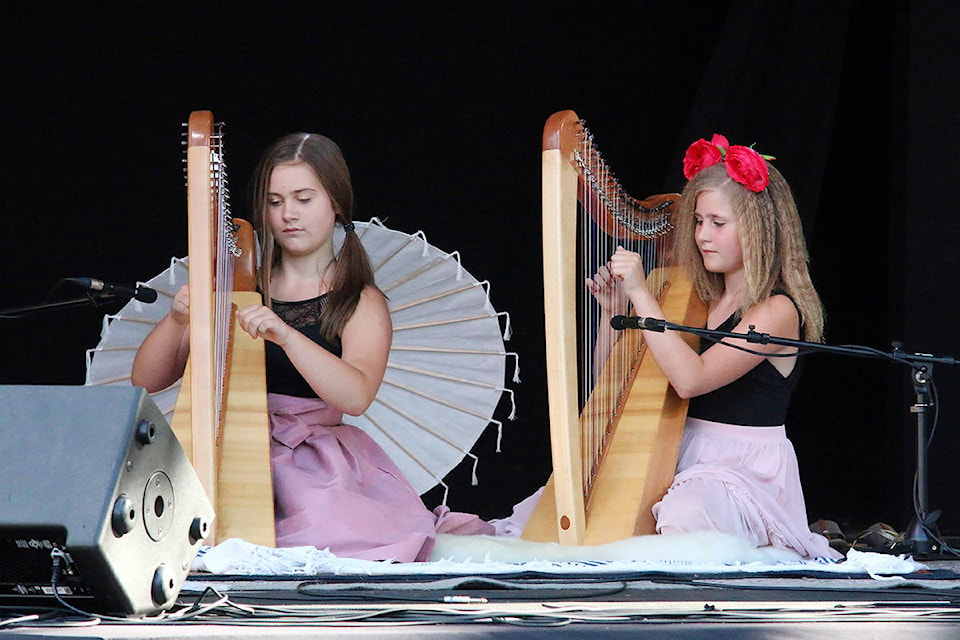 Nova Schultz, left, and her sister Lotus shared first place in the instrumental category of Duncan Has Talent Aug. 3. (Lexi Bainas/Citizen)
