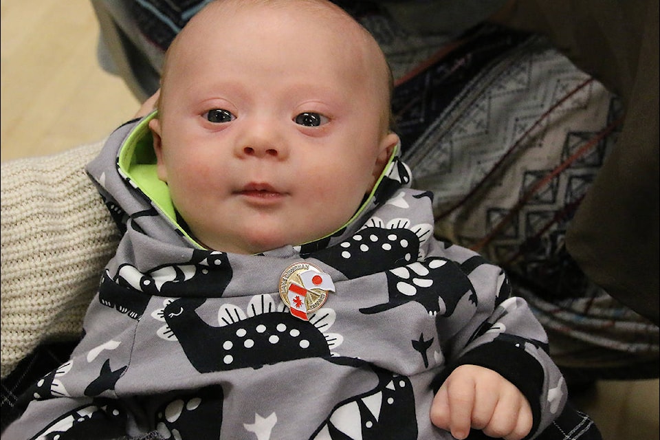 Two-month old Asher Fleming shows off his Ohtaki-Lake Cowichan pin at the banquet winding up the biennial visit of the delegation from Ohtaki. (Lexi Bainas/Gazette)