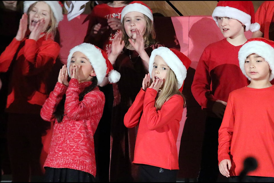 Children from Bench Elementary School enjoy singing in parts for their parents Dec. 13. (Lexi Bainas/Citizen)